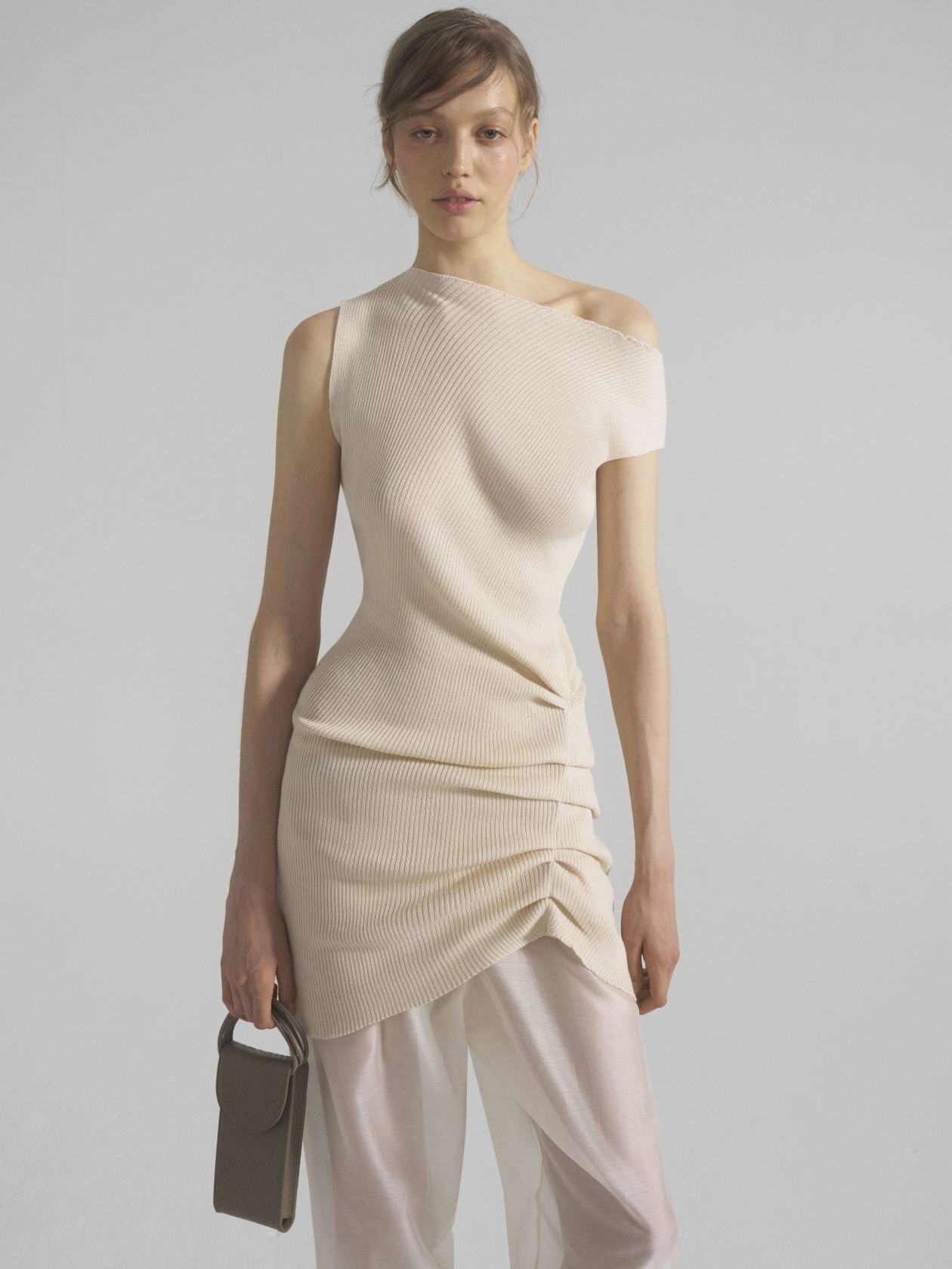The vest dress is asymmetrical — Level44